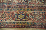 Vintage Mahal carpet border showing Samovar vine motif, saffron, brick red, and visible wear.