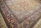 Corner of vintage Mahal carpet, brick red Samovar meandering vine border, saffron yellow field.