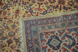 Vintage Mahal hand-knotted pile with saffron field, blue-red motifs, visible fringe, and woven reverse.