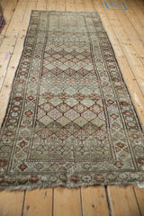Close-up of vintage distressed Caucasian runner, diamond lattice pattern with chestnut and ivory abrashes.