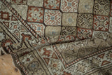 Distressed texture of vintage Caucasian runner's diamond lattice panels and abrashes.