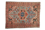 Vintage Heriz rug with sapphire blue hexagonal medallion and ruby red field patterns. 4'6