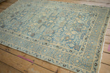 Side perspective of a vintage Tabriz rug highlighting its intricate geometric field and low pile.