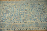 A vintage Persian Tabriz rug's geometric field in decorative powder blue, beige, and dusty bronze shades.