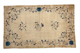 Antique hand-knotted Chinese Peking rug; ivory field, cobalt blue floral sprays, vine border, 4x6'8