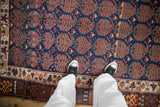 Antique Kurdish rug, cobalt blue field with copper boteh, animal figures, geometric borders.