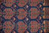 Antique Kurdish rug's hand-knotted texture with cobalt blue, copper, and mallard green geometric guls.