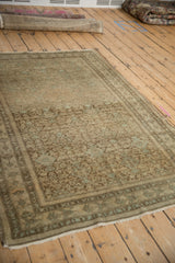 Distressed Malayer rug, displaying allover Herati pattern with worn pile and tattered edge.