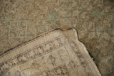 Hand-knotted foundation and distressed Malayer rug pile showing tattered edge.