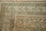Distressed antique Malayer rug pile with soft Herati pattern, time-softened hues.