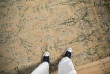 Antique Distressed Yezd rug showcasing time-softened cream, blue, green floral vines and mottled borders.