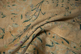 Expressively drawn floral vines and faded checkered blossoms on a distressed cream Yezd rug pile.