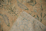 Worn cream floral pile revealing knot heads on the antique Yezd rug foundation.