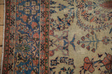 The intricate floral border and original side cord selvage on a hand-knotted Farahan Sarouk carpet.