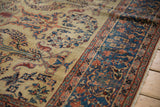 The low pile texture and detailed floral design on the corner of an antique Farahan Sarouk carpet.