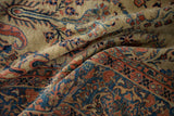 Soft, low pile texture of an antique carpet with boteh and floral sprays in rose and blue.
