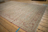 Distressed Tabriz carpet corner, featuring Herati field, Samovar border, and intact selvage.