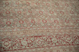 Distressed Herati field and Samovar border detail of vintage Tabriz carpet in dusty blue and red.