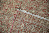 Distressed Herati pattern with madder red and dusty blue, revealing fringe and pink selvage.