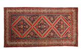 Antique Malayer carpet with triple red medallions, navy field, pomegranate and boteh motifs, vivid gem shades, 5'8