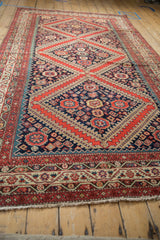 Antique Persian Malayer carpet end, with beige fringe and geometric red, navy borders.