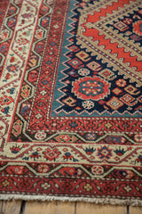 Antique Malayer Persian carpet border, rich with red, navy, ivory geometric floral motifs and fringe.