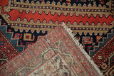 Antique Malayer Persian rug's hand-knotted foundation, knot heads, and geometric red and navy pile.