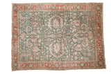 Vintage distressed Karaja carpet, sprawling palmettes and vines in dusty green, terracotta.