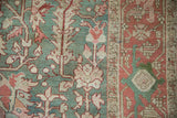 Distressed vintage Karaja carpet showing dusty jade green floral field and Samovar Turtle border.