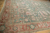 Distressed Karaja rug corner with Samovar Turtle border motif in jade and terracotta.
