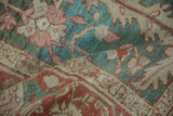 Distressed vintage Karaja carpet detail with unique celadon green, pale ruby, and sand tones.