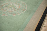 Dusty mint green Art Deco medallion and variegated border of antique Nichols rug.