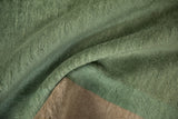 Textured dusty mint green pile and woven foundation of the antique Nichols carpet.