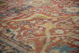 Detailed view of an antique Heriz carpet showing the texture of its low pile and worn knot heads.
