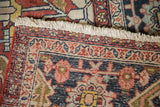 Secured end of an antique Heriz carpet showing its short fringe and hand-knotted border.