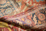 Detail of an antique Heriz carpet showing the purple foundation beneath the time-softened wool pile.