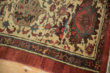 Antique Persian Bakshaish rug corner, sapphire blue Herati field meets cochineal red main border.