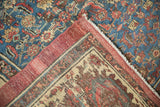 Antique Bakshaish carpet corner, sapphire blue Herati field, cochineal red border, ivory fringe.