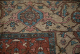 Antique Karaja carpet detail: geometric stepped medallion, blossom motifs, dusty teal, and raspberry.