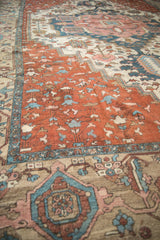 Antique Karaja carpet detail: long stemmed blossoms in copper, dusty blue, and beige palette.