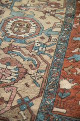 Antique Karaja carpet detail of stepped medallion, blossoms, wear in copper, dusty teal, beige.