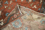 Antique Karaja carpet corner revealing worn copper pile, dusty teal designs, and visible hand-knotted foundation.