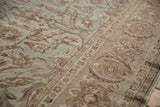 Distressed Yezd carpet with faded powder blue, blush palmettes, connecting vines, and Herati border.