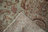 Yezd vintage carpet corner showing distressed powder blue field of palmettes and tight hand-knotted reverse.