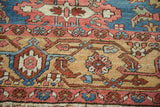 Antique Bakshaish rug detail showing serrated guls, floral patterns in sky blue, blush, and sand.
