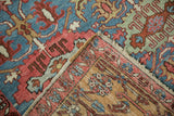 Antique Persian Bakshaish rug's tightly woven back, intact selvage, fringe, and blue, blush motifs.