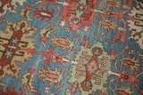 Serrated guls, floral motifs, and aquatic blue abrashed ground of antique Bakshaish carpet.