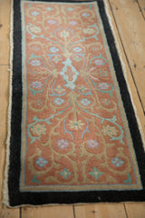 Full length perspective of the antique Nichols Art Deco rug's distinctive floral pattern.