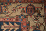 Gorevan carpet with geometric palmettes and plant motifs in sapphire blue and blush tones.