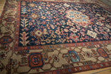 Vintage Gorevan carpet close-up of Turtle Samovar border, madder root red, and navy field.